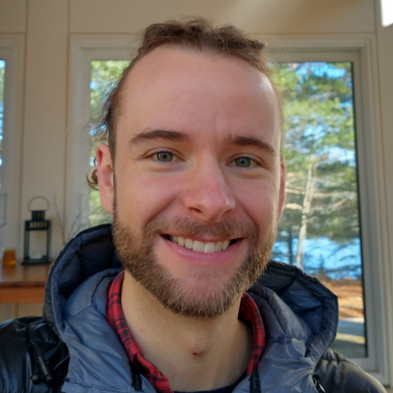 Ezekiel has blue eyes, white skin and a short beard.